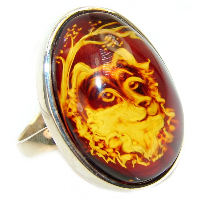 a Dignified Wolf Authentic Baltic Amber .925 Sterling Silver handcrafted ring; s. 8 adjustable