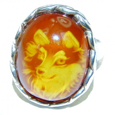 A Wolf Authentic CARVED Baltic Amber .925 Sterling Silver handcrafted ring; s. 8