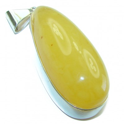An exuberantly Large authentic butterscotch Baltic Amber .925 Sterling Silver handcrafted pendant