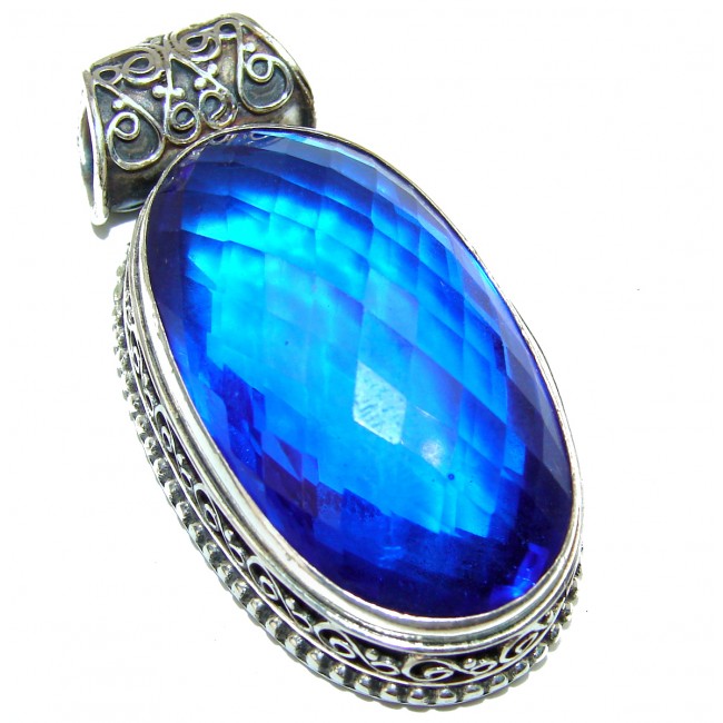 33.5 carat Genuine Electric Blue Quartz .925 Sterling Silver handcrafted pendant