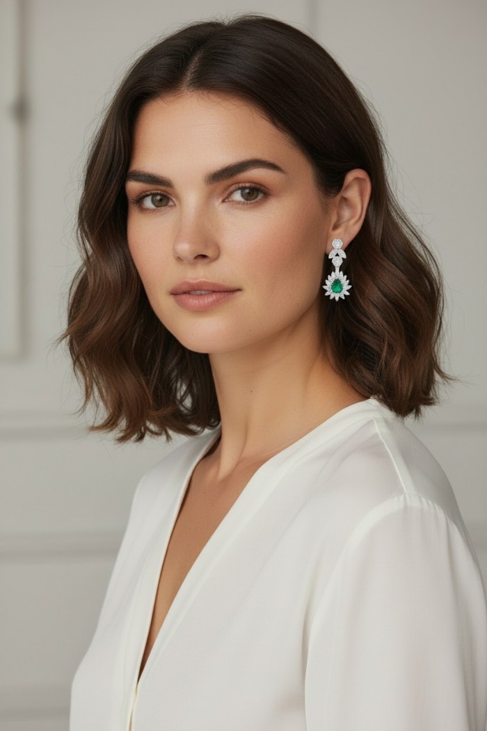 Estelle - Authentic 3.9 carat COLOMBIAN EMERALD rhodium over .925 Sterling Silver handcrafted earrings - Woman wearing Estelle earrings with Colombian emerald, side view.
