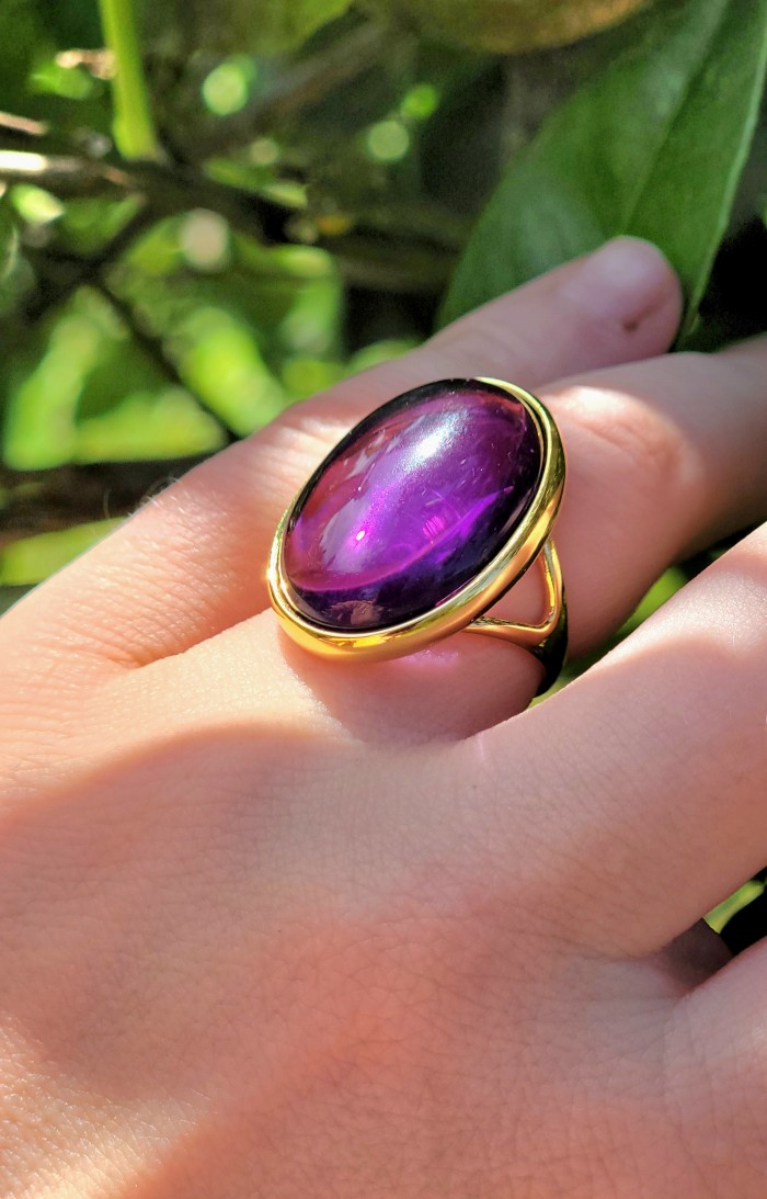 22.2 carat Amethyst 14K Gold over .925 Sterling Silver Handcrafted Large Ring size 7 1/4 - Amethyst ring worn on hand, oval stone in gold setting, close-up view.