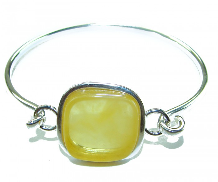 Genuine Butterscotch Polish Amber .925 Sterling Silver handmade Bracelet / Cuff - Close-up of butterscotch amber and silver bracelet against white background.