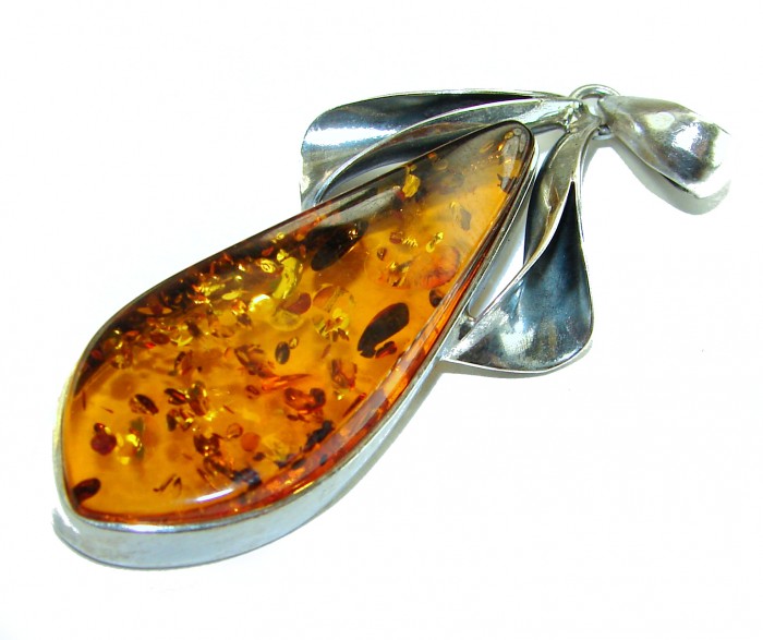 Prehistoric Authentic Baltic Amber .925 Sterling Silver beautifully handcrafted Pendant - Baltic amber pendant in .925 silver setting, side view close-up.