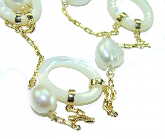 Precious White Blister Pearl 4K Gold over .925 Sterling Silver .925 Sterling Silver Necklace - Close-up of pearl and gold chain jewelry with circular elements.