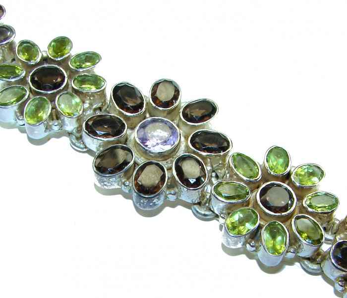Lavishly Abundant - Huge Spectacular 175.9 carat authentic Amethyst Peridot .925 Sterling Silver handmade Bracelet - Close-up of gemstone bracelet with green and brown stones.