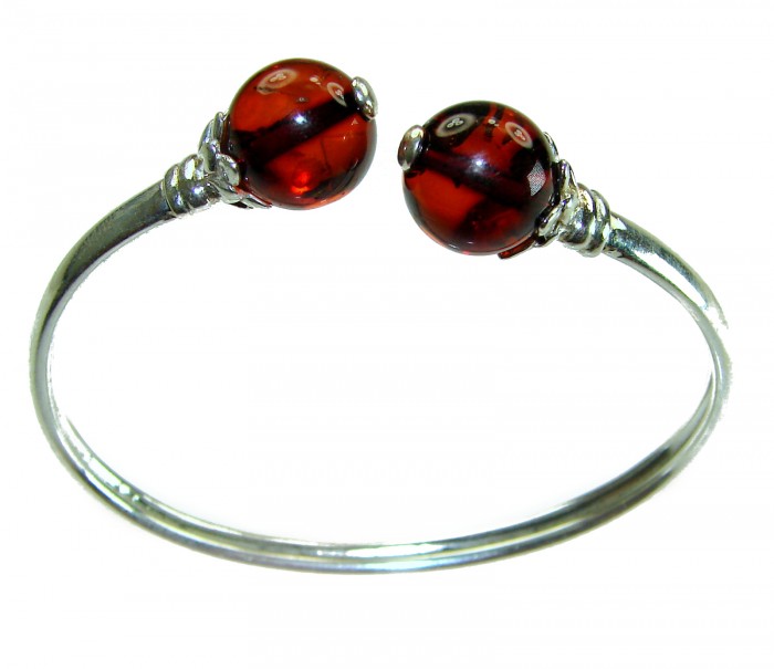 Golden Butterfly Genuine Baltic Amber .925 Sterling Silver handamde Bracelet - Open design bracelet with red amber spheres, front view.