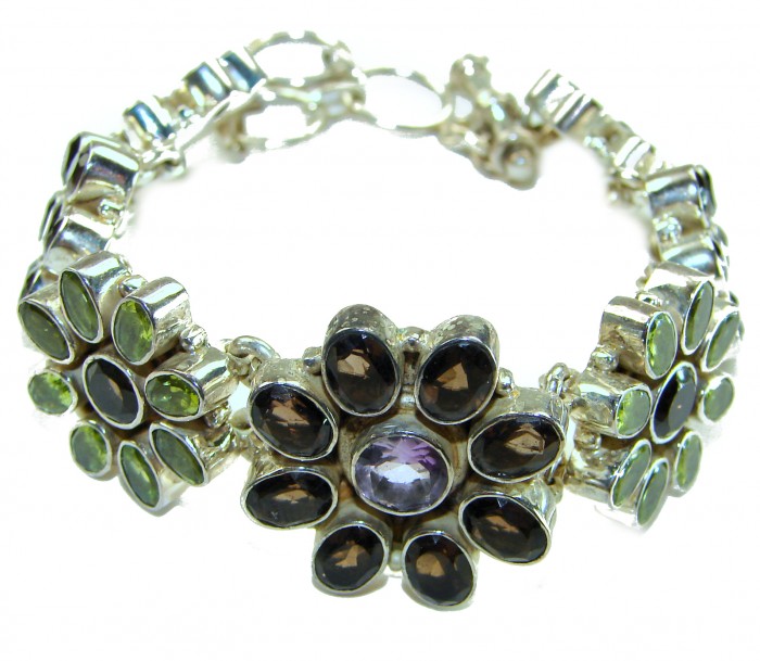 Lavishly Abundant - Huge Spectacular 175.9 carat authentic Amethyst Peridot .925 Sterling Silver handmade Bracelet - Bracelet side view showcasing multicolored gemstones and floral design.