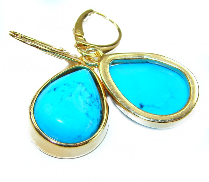 Great authentic Sleeping Beauty Turquoise 18K Gold over .925 Sterling Silver handcrafted Earrings - Close-up of gold and turquoise earrings with stone detail.