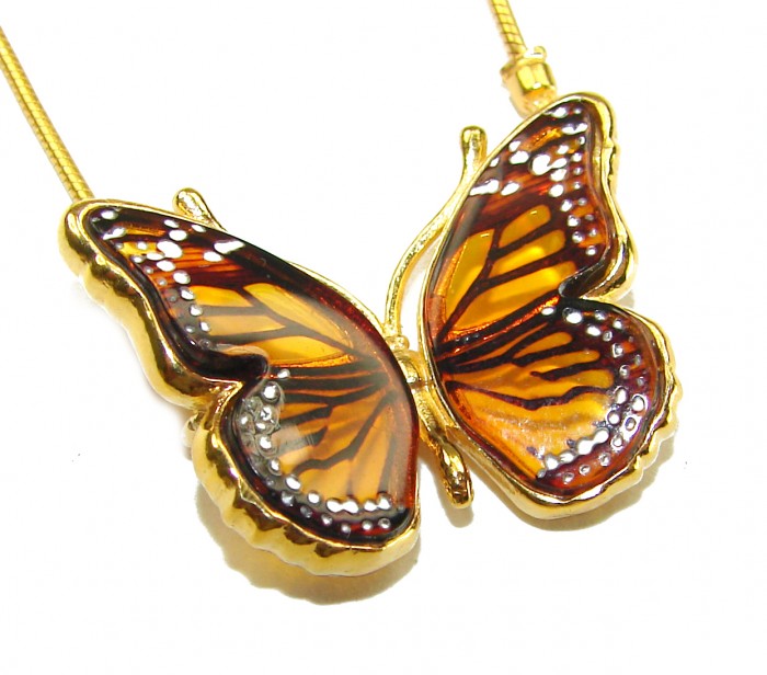 Golden Butterfly Genuine carved Baltic Amber 18K Gold over .925 Sterling Silver handamde Bracelet - Golden butterfly amber pendant in close-up view with 18K gold trim