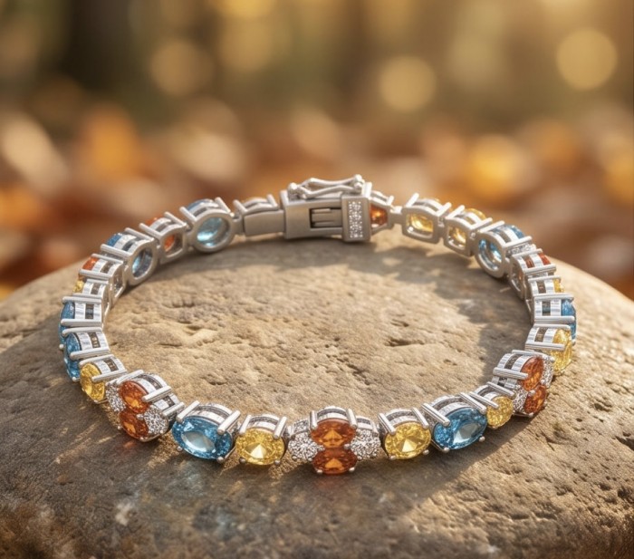 Gabriella 22.2 carat authentic multicolor Sapphire rhodium over .925 Sterling Silver handcrafted Statement Bracelet - Gabriella multicolor sapphire bracelet, top view on stone background.
