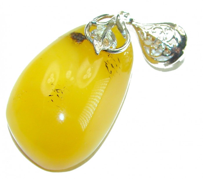 Prehistoric Authentic Baltic Amber .925 Sterling Silver beautifully handcrafted Pendant - Amber pendant with filigree silver clasp, close-up view.