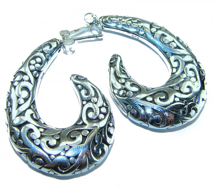 1 5/8 inches long - Free Spirit bohemian Style .925 Sterling Silver handmade Bali made Oversized Earrings - Ornate silver earrings with detailed patterns, top view.
