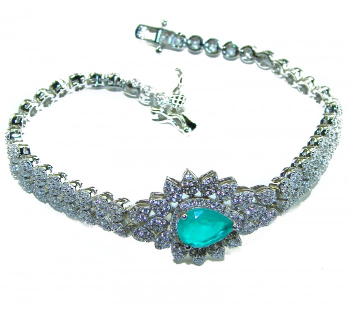 Born to Glam authentic 7.9 carat Colombian Emerald .925 Sterling Silver handcrafted Statement Bracelet - Close-up of bracelet with emerald centerpiece and diamond details.