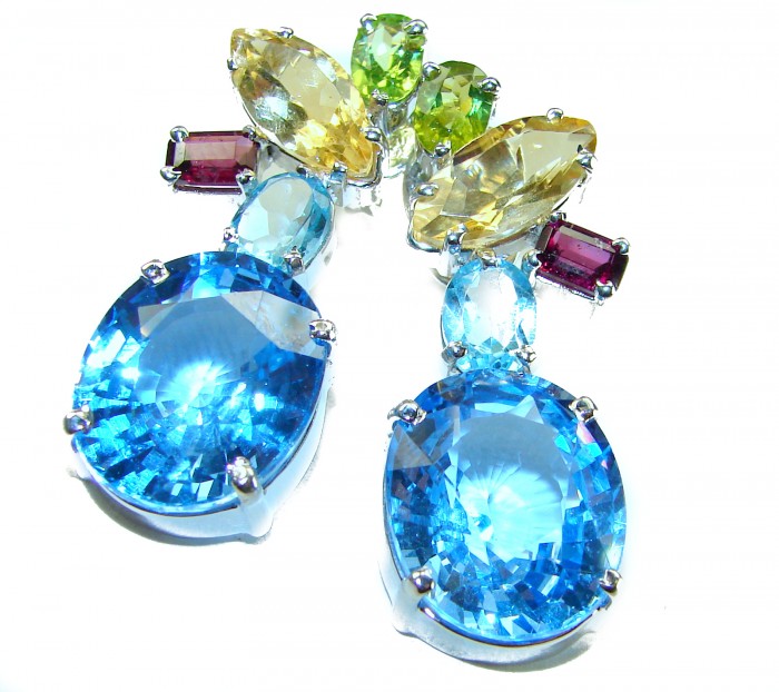 Atlantica 31.7 carat Swiss Blue Topaz .925 Sterling Silver Handcrafted Statement earrings - Close-up of colorful gemstones in Swiss Blue Topaz earrings.