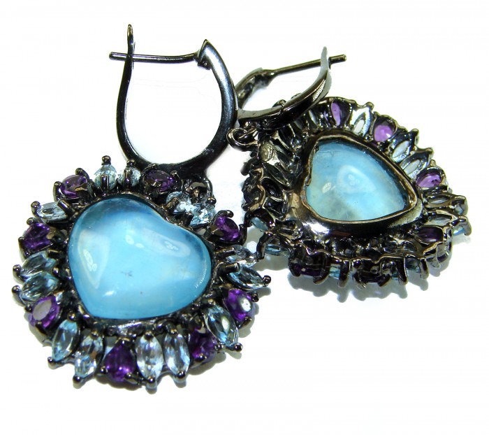 A Heritage in Bloom 12.5 carat Aquamarine black rhodium over .925 Sterling Silver handmade Large Statement Earrings - Heart-shaped earrings with aquamarine and amethyst stones, close-up.