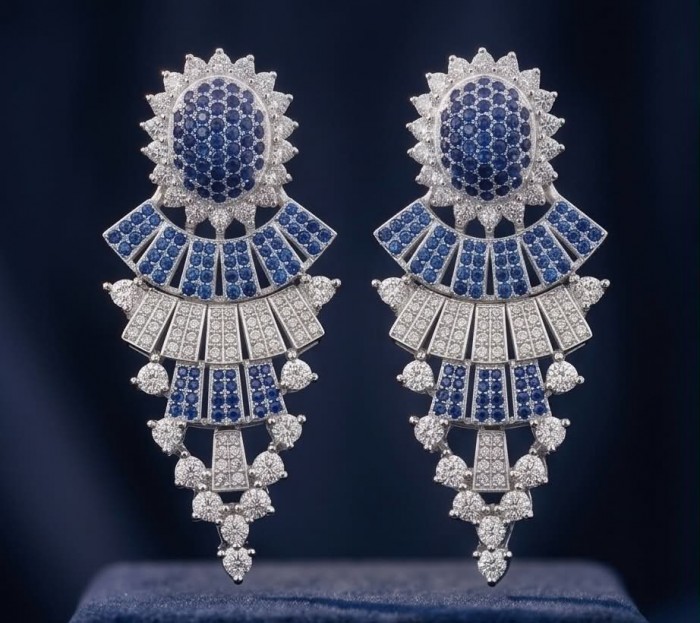 Authentic 4.7 carat Sapphire Rhodium over .925 Sterling Silver handcrafted Statement earrings - Close-up of sapphire and diamond drop earrings on a dark background