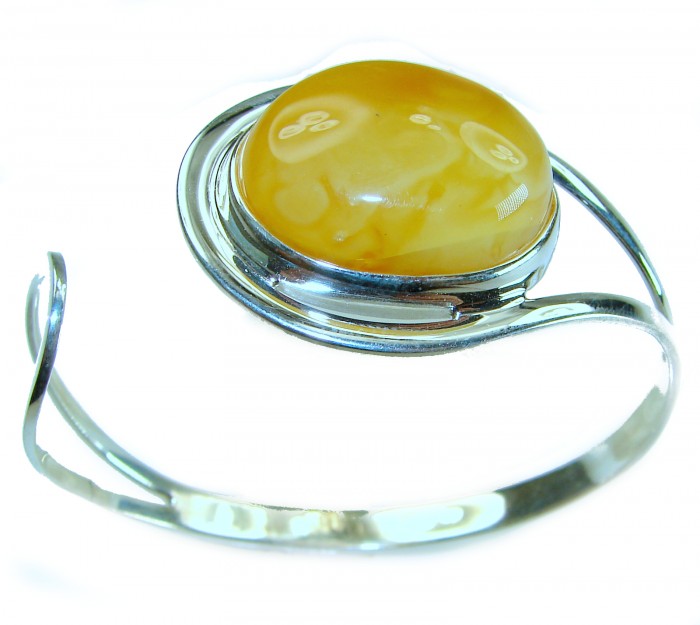 Vintage Design 21.8 grams Genuine Butterscotch Polish Amber .925 Sterling Silver handmade Bracelet / Cuff - Side view of vintage butterscotch amber bracelet with silver setting.