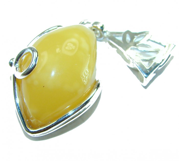 Prehistoric Authentic Butterscotch Baltic Amber .925 Sterling Silver beautifully handcrafted Pendant - Close-up of butterscotch Baltic amber pendant with sterling silver details