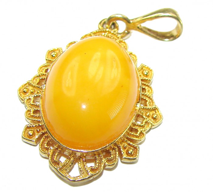 Gold of the Baltic Sea Authentic Butterscotch Baltic Amber 14K Gold over .925 Sterling Silver beautifully handcrafted Pendant - Close-up of butterscotch Baltic amber pendant with ornate gold setting.