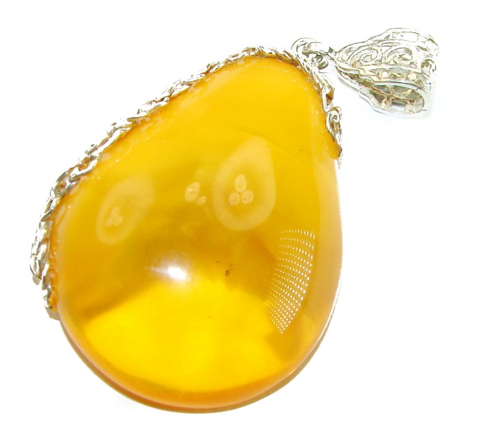 Prehistoric Butterscotch Authentic Baltic Amber .925 Sterling Silver beautifully handcrafted Pendant - Baltic amber pendant close-up with silver detailing.