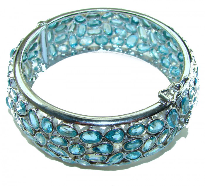 Blue Odyssey- One of the kind - 165.2 carat Swiss Blue Topaz .925 Sterling Silver handmade bangle Bracelet - Bangle side view with blue topaz stones and clasp detail.