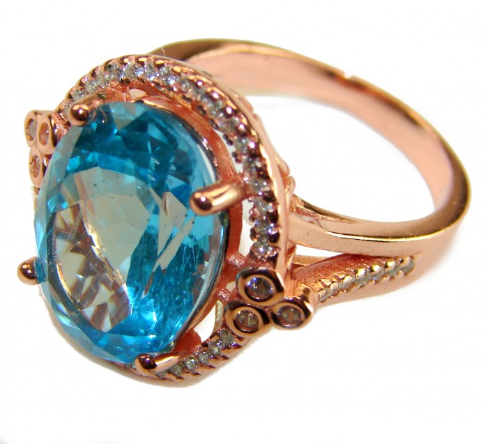 Endless Ocean Natural 14.4 carat Swiss Blue Topaz .925 Sterling Silver dipped in 18K Gold handmade Large Statement Ring size 9 - Side view of Endless Ocean Swiss Blue Topaz ring with rose gold accents