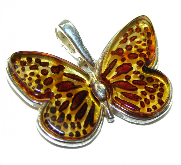 Prehistoric Authentic Butterscotch Baltic Amber .925 Sterling Silver beautifully handcrafted Pendant - Butterfly-shaped amber pendant, top view, silver mounting detail