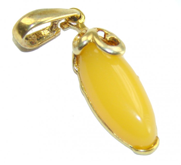 Prehistoric Authentic Buttescotch Baltic Amber 14K Gold over .925 Sterling Silver beautifully handcrafted Pendant - Side view of butterscotch Baltic amber pendant in 14K gold setting.