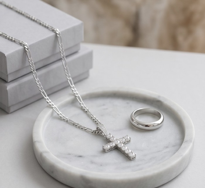 Precious Cross Genuine rhodium over .925 Sterling Silver handmade necklace - Rhodium cross pendant and ring on marble tray, top view.