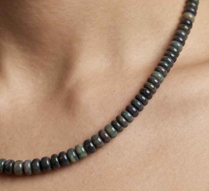 Mystery 22.2 carat Black Opal .925 Sterling Silver .925 Sterling Silver Statement Necklace - Close-up of black opal necklace worn on neck, showcasing beads.