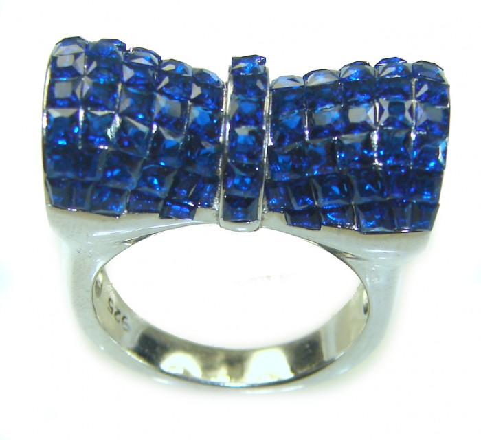 Endlessly Enchanting - 19.2 carat Authentic Sapphire .925 Sterling Silver handmade Statement Ring size 7 - Front view of sapphire ring with bow design, silver band visible.