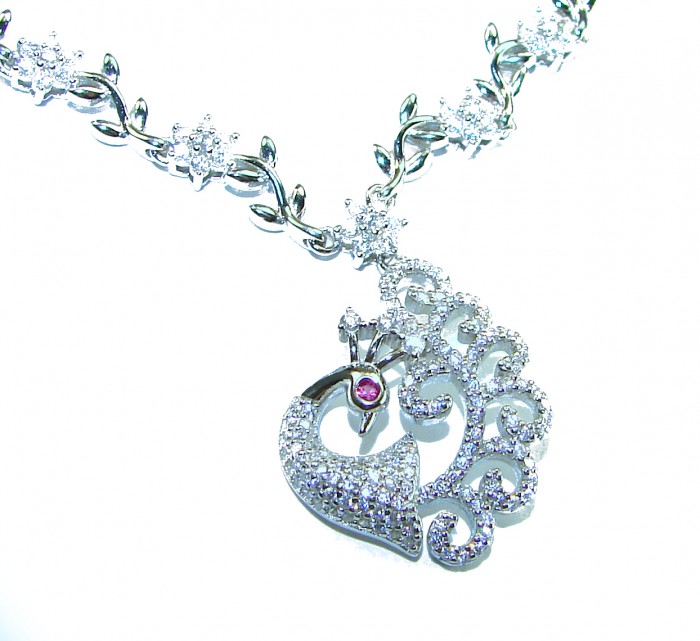 Graceful Swan shimmering White Topaz .925 Sterling Silver handcrafted necklace - Necklace with swan pendant, topaz stones, side close-up.
