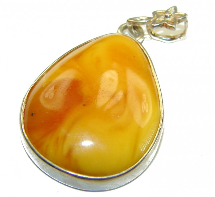 Prehistoric Authentic Baltic Amber .925 Sterling Silver beautifully handcrafted Pendant - Close-up of Baltic amber pendant with sterling silver setting.