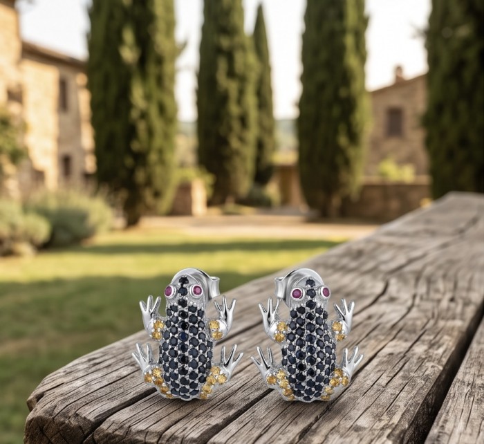 Large Blue Frogs 4.2 carat Sapphire rhodium over .925 Sterling Silver handcrafted earrings - Earrings with 4.2 ct sapphire frogs on wooden surface, angled front view.