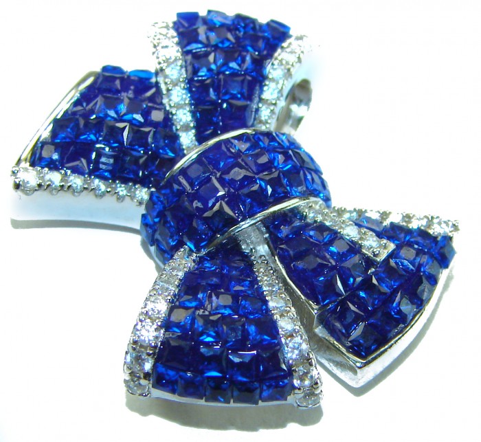 Heirloom blue Bow Genuine 17.5 carat Sapphire .925 Sterling Silver handmade Pendant - Close-up of heirloom blue sapphire bow brooch with diamond accents.