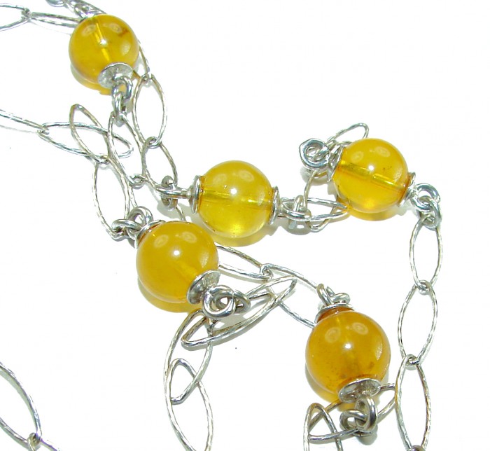 Dazzling vintage natural Baltic Amber .925 Sterling Silver handcrafted station necklace - Close-up of vintage Baltic Amber necklace with sterling silver links.