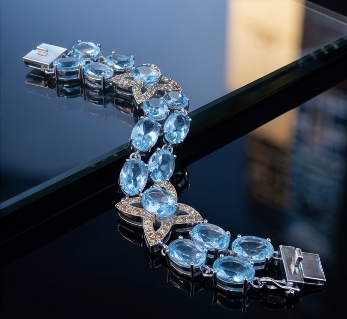 Tiffany - Magnificent 52.5 carat Swiss Blue Topaz .925 Sterling Silver handcrafted Statement Bracelet - Top view of Tiffany blue topaz bracelet with detailed stones and clasp.