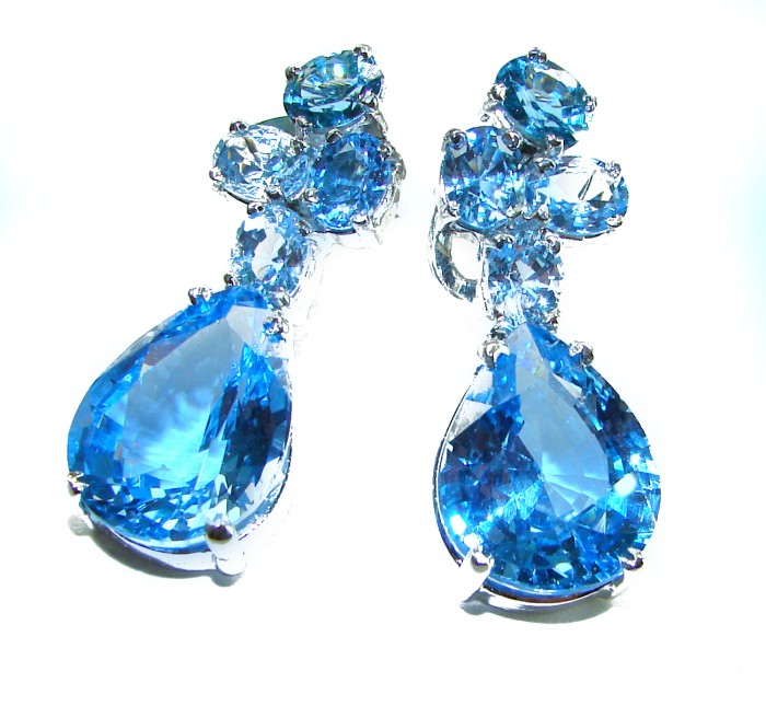 Blue Odyssey 29.5 carat authentic Swiss Blue Topaz .925 Sterling Silver handmade Statement earrings - Close-up of Blue Odyssey Swiss Blue Topaz earrings on white background
