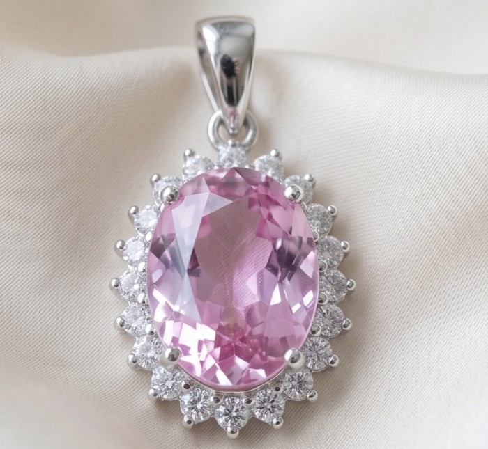 Incredible oval cut 15.8 carat Pink Sapphire .925 Sterling Silver handcrafted pendant - Close-up of oval cut pink sapphire pendant with diamond accents.