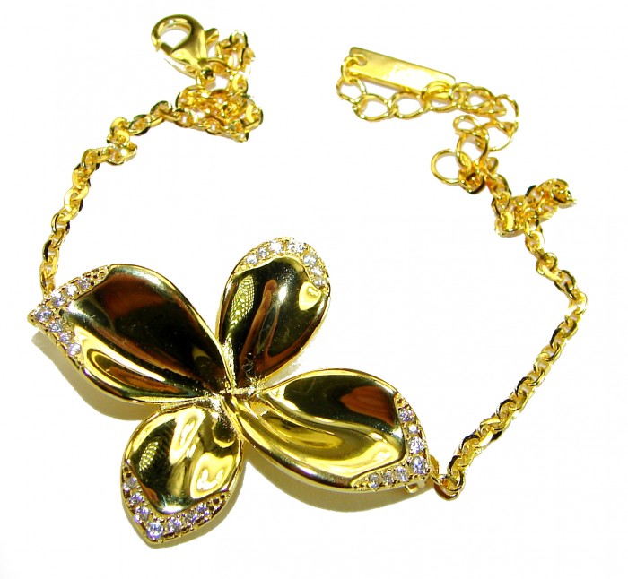 Lotus flower White Topaz highly polished 18K Gold over .925 Sterling Silver Italy made bracelet - Gold lotus flower bracelet with white topaz detail, top view.