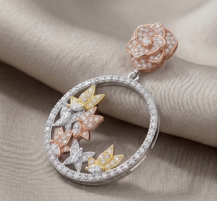 Black Label Collection - Floral design - Natural White Topaz 22K Gold over .925 Sterling Silver handmade 3 tones earrings - Close-up of floral design pendant with white topaz stones.