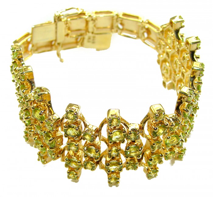 Natural 45.8 carat Peridot 14k Gold over .925 Sterling Silver handmade small size Statement Bracelet - Gold and peridot bracelet, angled side view, intricate stone detail.