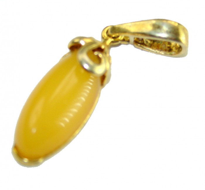 Prehistoric Authentic Buttescotch Baltic Amber 14K Gold over .925 Sterling Silver beautifully handcrafted Pendant - Side view of a butterscotch Baltic amber pendant with gold detailing.