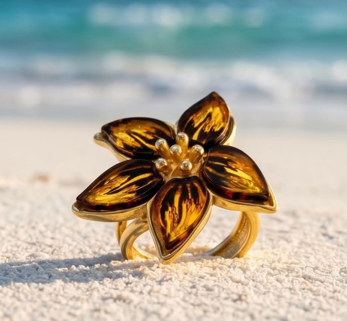 Golden Flower Authentic Baltic Amber 18K Gold over .925 Sterling Silver handcrafted ring; s. 7 adjustable - Golden flower ring with amber petals on sandy beach, close-up view.