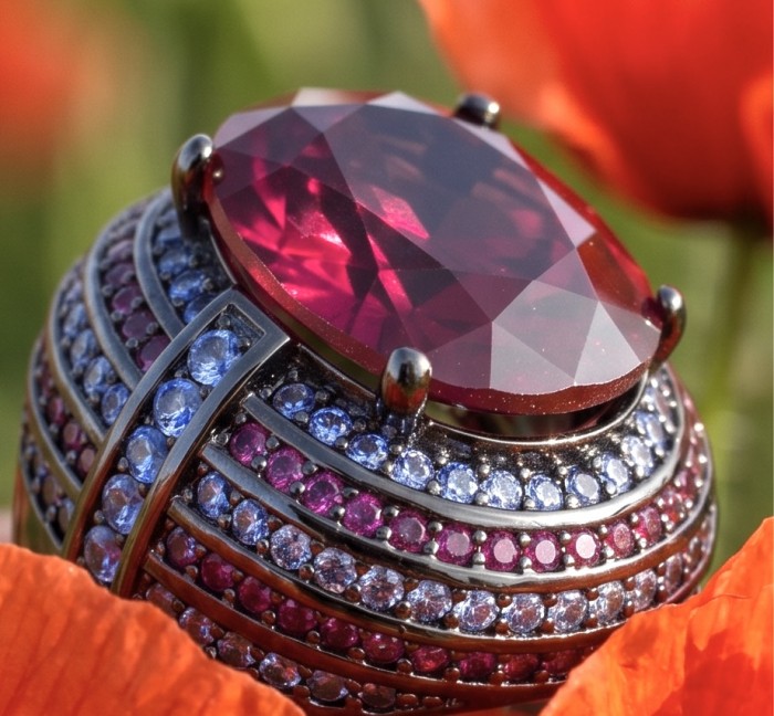 Bella Rosa Genuine 12.5 CARAT Ruby black rhodium over .925 Sterling Silver Statement Ring size 7 - Close-up of Bella Rosa 12.5 carat ruby ring with blue and pink accents