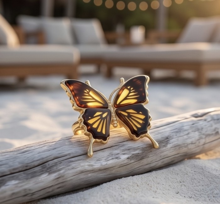 Butterfly Authentic Baltic Amber .925 Sterling Silver dipped in 18K Gold handcrafted ring; s. 7 adjustable - Butterfly Baltic Amber ring on driftwood, beach background, evening light.