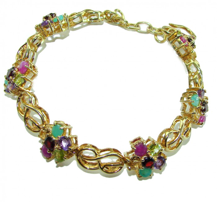 One of the kind 28.5 carat genuine Multigem 18k Gold over .925 Sterling Silver Bracelet - Gold multigem bracelet, top view, showcasing colorful stones and design.