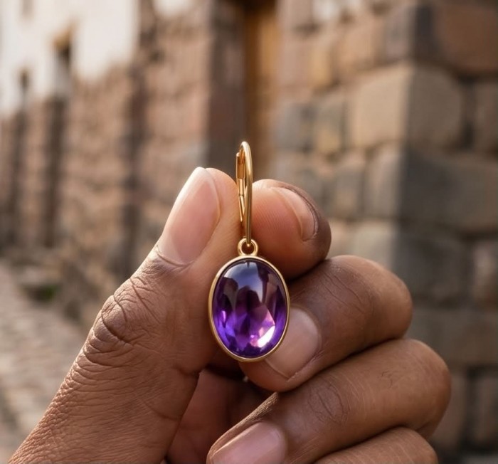 Lavender Beauty authentic 18.2 carat Amethyst 14K Gold over .925 Sterling Silver handcrafted earrings - Close-up of 18.2 carat Amethyst necklace held between fingers.