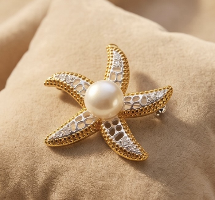 Genuine Mother of Pearl 14K Gold .925 Sterling Silver handmade Pendant Brooch - Starfish brooch with pearl on fabric, angled view
